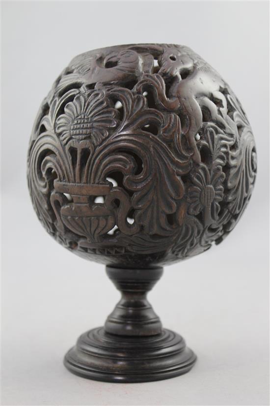 A 19th century carved and pierced coconut cup or goblet, 7.25in.